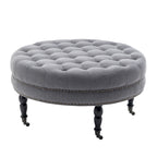 Pouf de cocktail rond en tissu Indy Porthos Home avec pieds et roulettes en bois d'hévéa