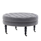 Pouf de cocktail rond en tissu Indy Porthos Home avec pieds et roulettes en bois d'hévéa